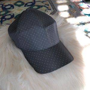 A light grey and polka dot baseball hat